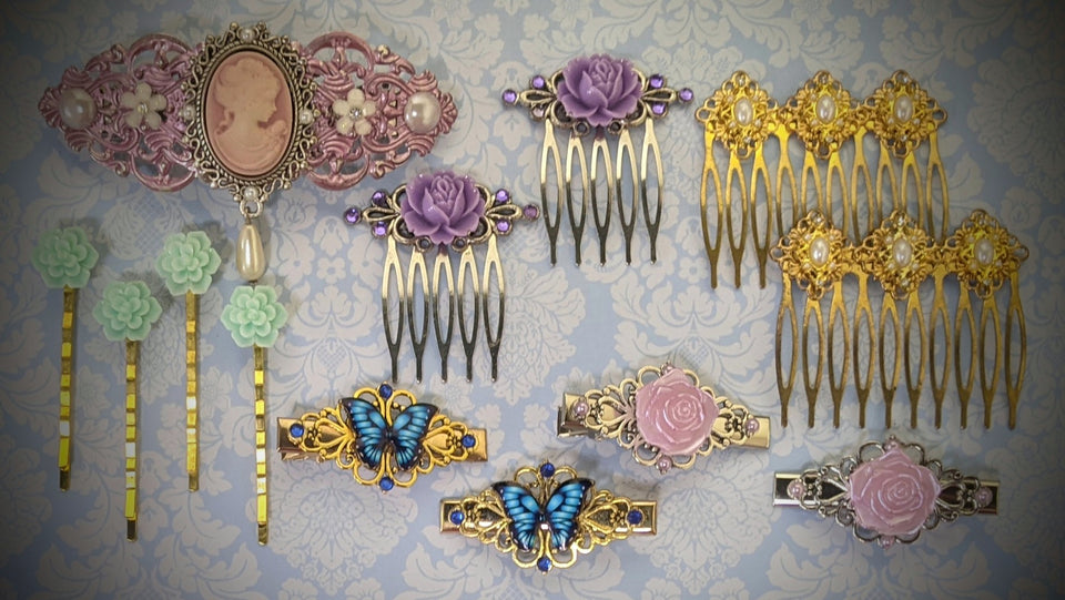 Handmade hair accessories made with a variety of beautiful stones, crystals. resin flowers, cameos, pearls, charms and more. The collection consists of barrettes, hair clips. bobby pins, hair combs, etc. Available in silver and gold plated finishes.