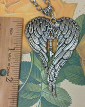 Load image into Gallery viewer, Beautifully detailed Angel Wing pendant measures 2-1/2&quot; x 1-3/4&quot;.
